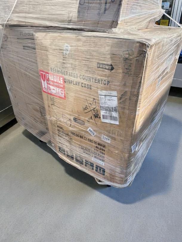 KoolMore Refrigerated Countertop Display Case in box, Model CDC-3C-BK/CDC-3C-WH, scratch & dent, fragile labeling visible.