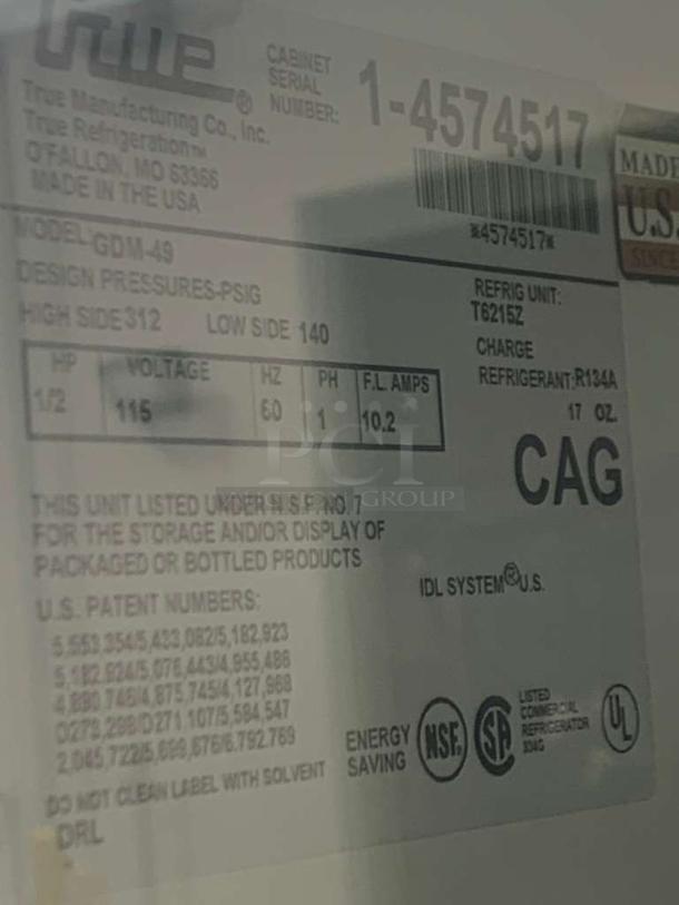 True GDM-49 Glass Door Merchandiser Refrigerator label showing model, voltage (115V), and serial number. Made in USA.