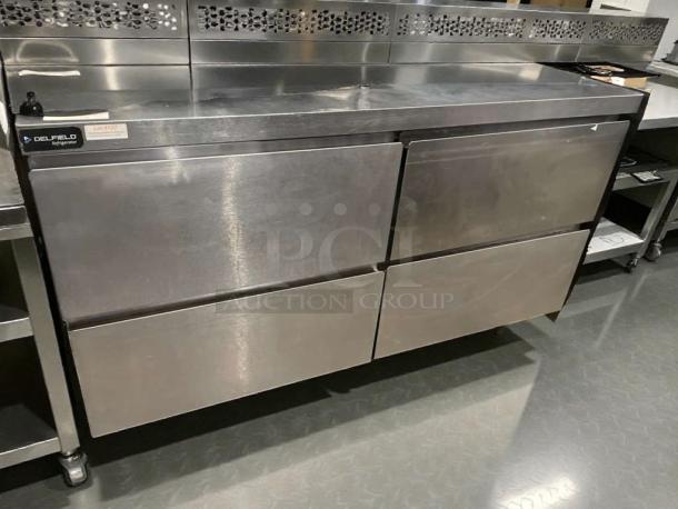 Immaculate Delfield GUR60BP-D undercounter refrigerator, stainless steel, tested, working, 115V, model label visible.