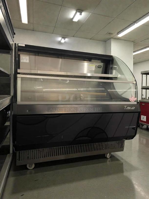 Turbo Air TOM-50LB commercial display refrigerator, top-tier condition, 120V, fully tested, glass front, black exterior.