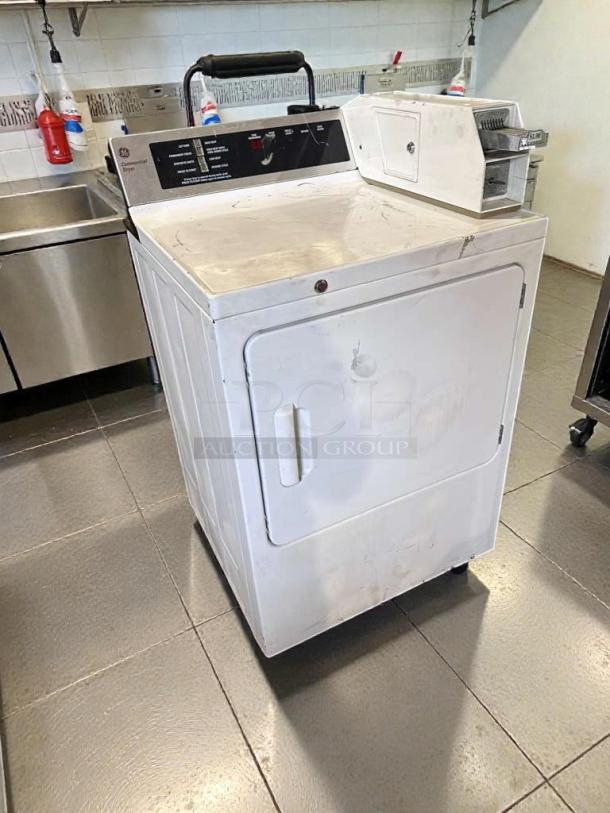 Immaculate GE coin-operated dryer, model DCCD330ED2WC, in pristine condition. Fully tested; 120/208–240V.