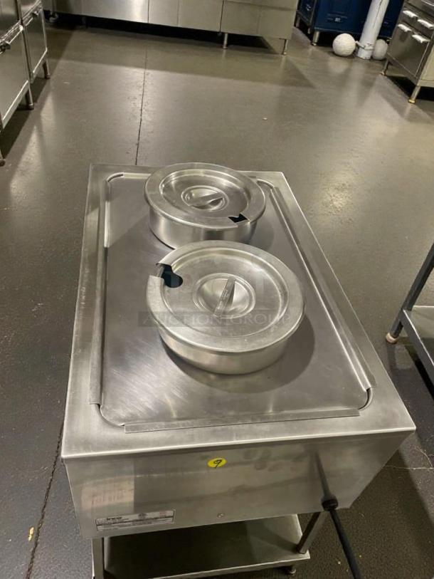 Winco FW-S500 electric food warmer, stainless steel, dual lids, excellent condition, 120V, model label visible, fully tested.