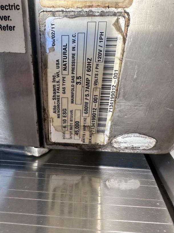 Alto-Shaam 6.10 ESG heated display cabinet label, natural gas, 45,000 BTU, 680W, inspected, quality assurance tag visible.
