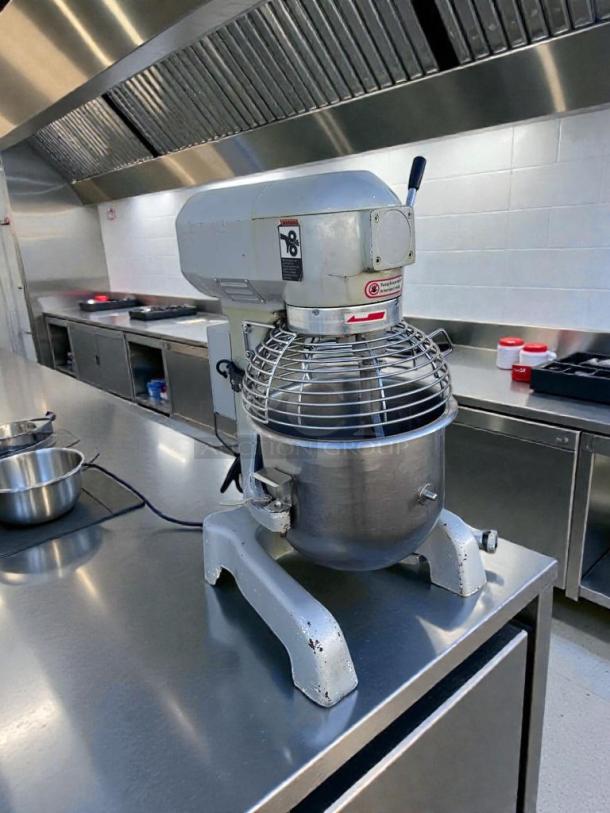 Commercial UPM-M20-3 planetary mixer, 20 qt, 110V, superior condition, fully tested, with safety guard and operational labels.