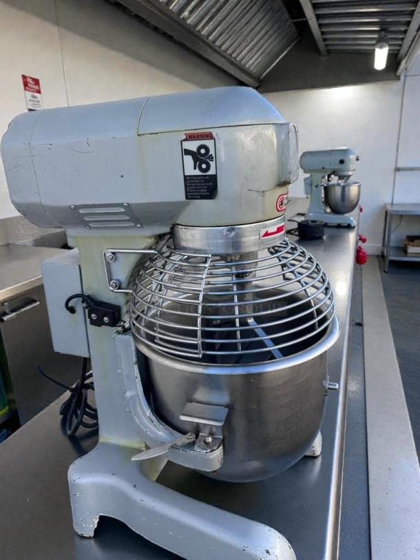 Commercial UPM-M20-3 20 Qt Planetary Mixer, 110V. Superior condition, tested and working. Visible safety and operation labels.