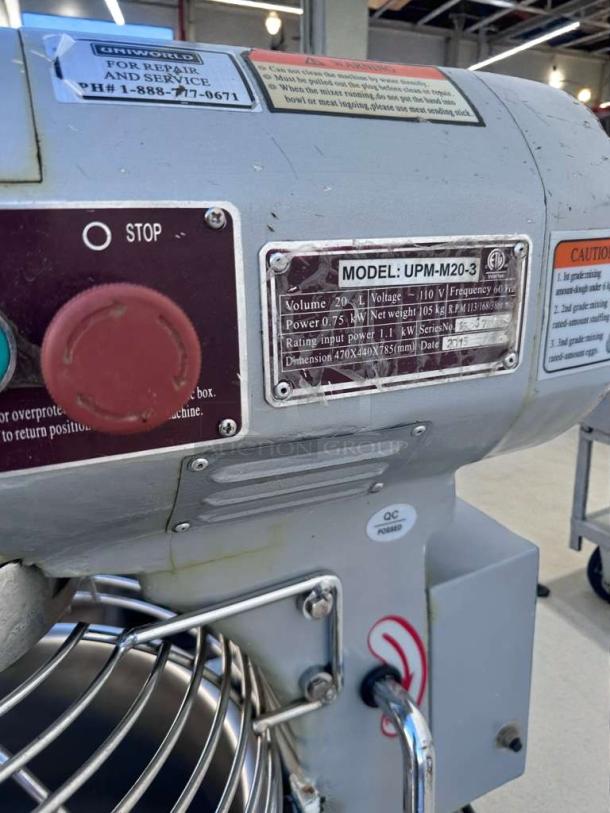 Commercial UPM-M20-3 planetary mixer, 20 qt, 110V, fully tested. Features stop button and metal label with model specs.