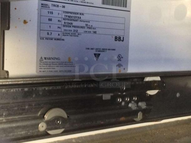 Traulsen TRCB-36 chef base label showing model, voltage, refrigerant type, and safety warnings. Fully tested and working.