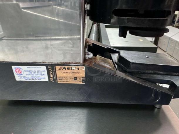 Astoria commercial espresso coffee grinder, 115V, UL Listed, fully tested. Labels display brand and voltage details.