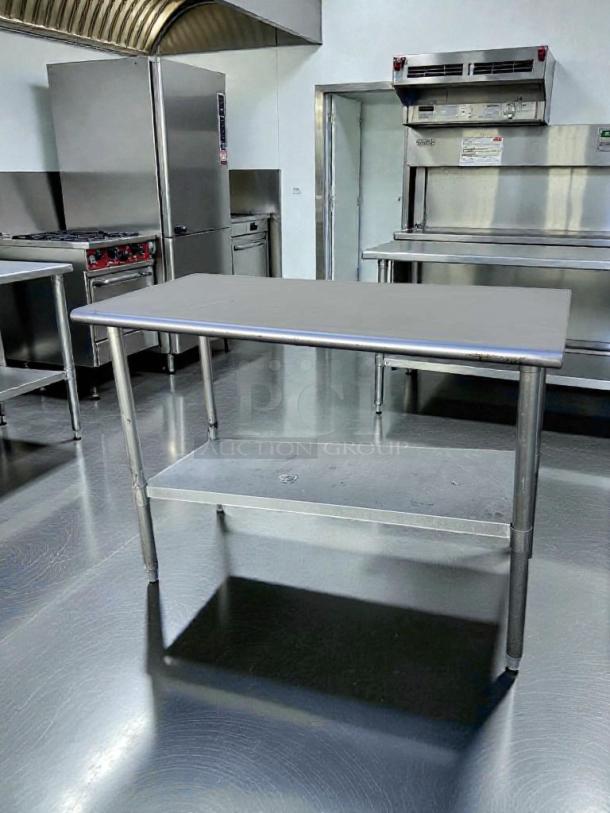 Commercial stainless steel prep table, 48" x 24", with undershelf. Fully tested, refined condition, NSF certified.