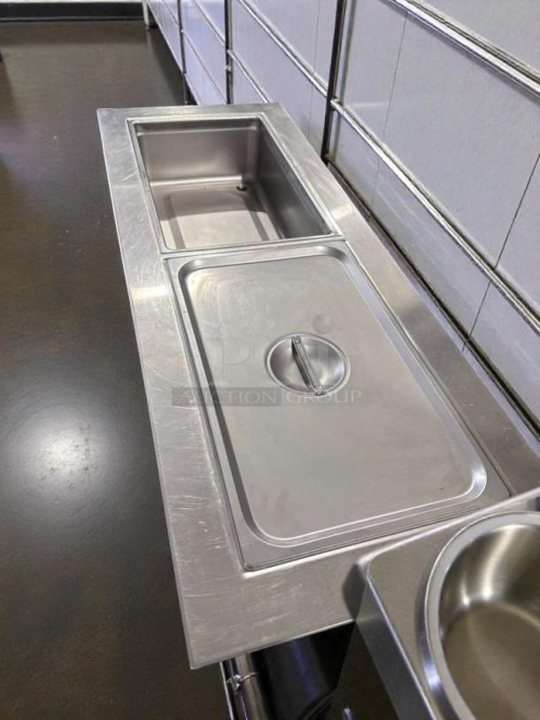 Delfield 8148-EFN refrigerated cold food table in exceptional condition, stainless steel, NSF & UL listed, fully operational.