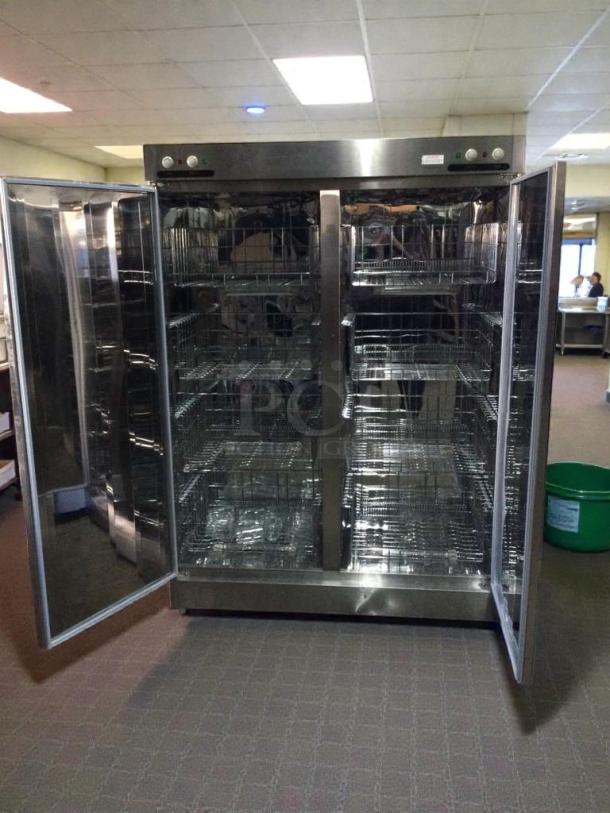 Commercial stainless steel sterilizer cabinet, model XDR640-F1A, in superior condition. Fully tested, shelves visible.