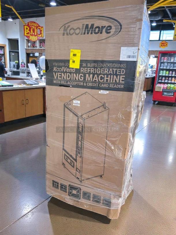 Brand new KoolMore KM-VMR-30-BR vending machine in packaging, 36 slots, accepts bills and cards, scratch & dent condition.