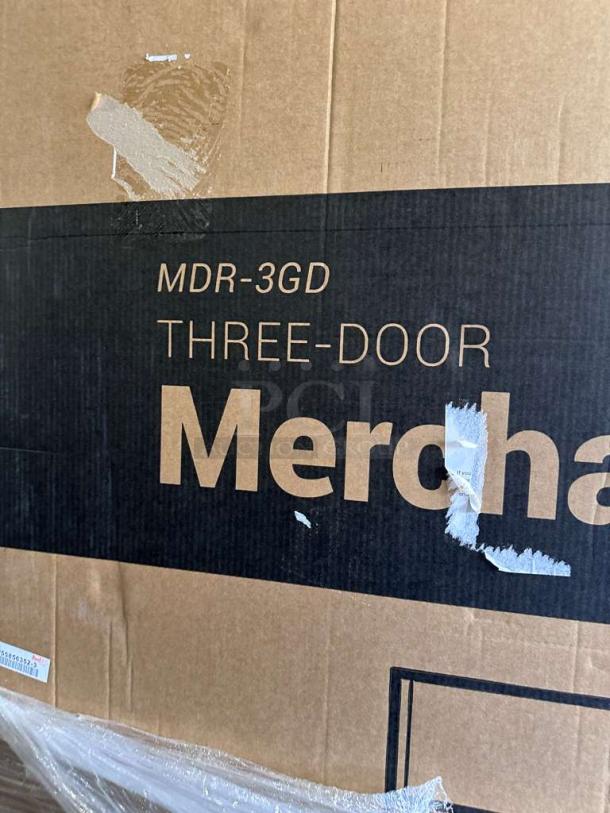 KoolMore 3-Door Glass Merchandiser Refrigerator box, model MDR-3GD, brand new condition with visible scratches and dents.