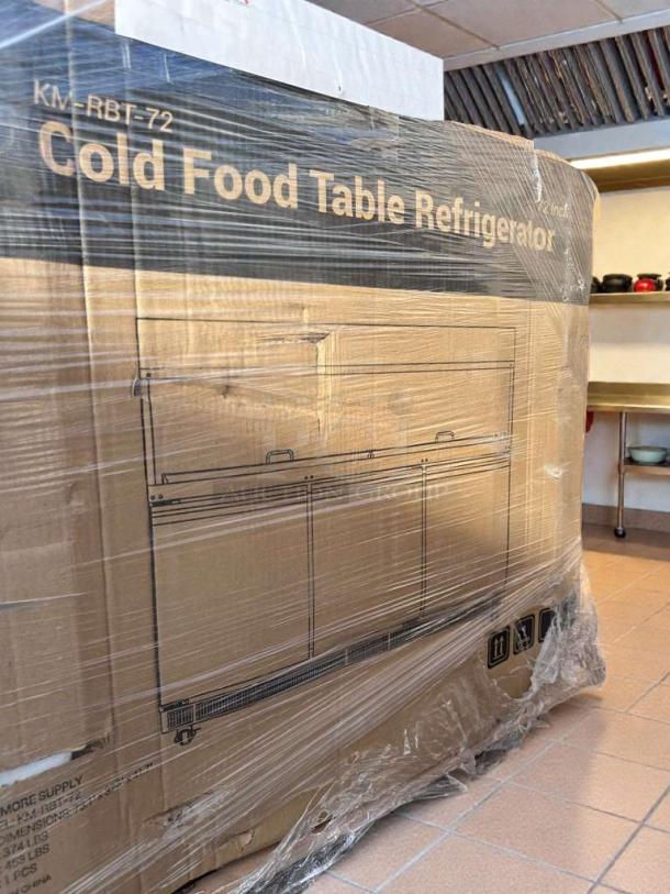 Brand new Koolmore 72" Refrigerated Prep Station (KM-RBT-72C) in original packaging, labeled with model and condition details.
