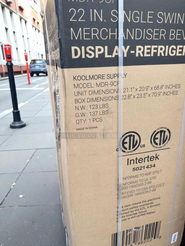 KoolMore MDR-9CP electric merchandiser refrigerator in original packaging. Model details and dimensions on box. New condition.