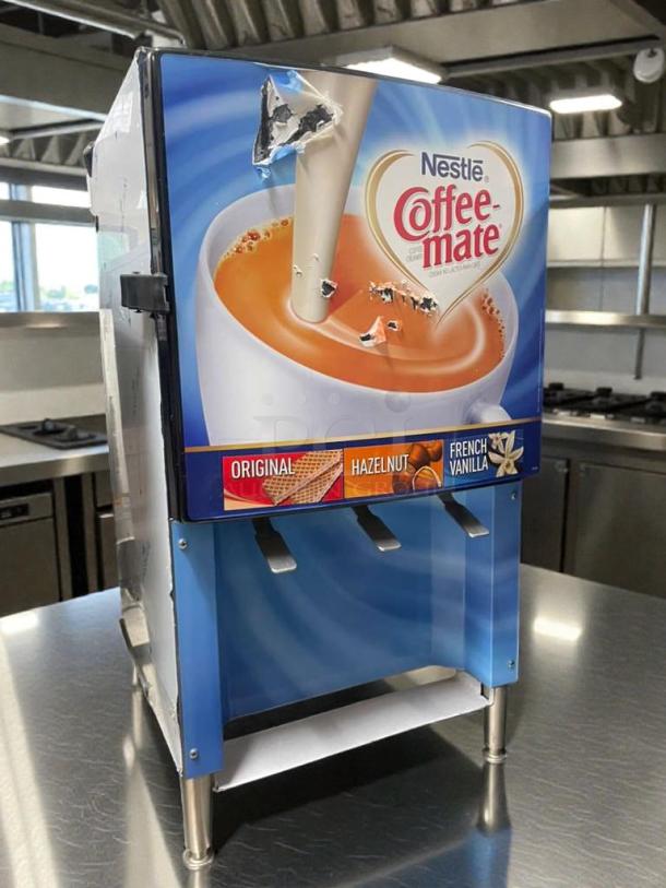 Silver King refrigerated cream dispenser, model SKNES2B/3B, in excellent condition, with Coffee-mate branding, 120V.
