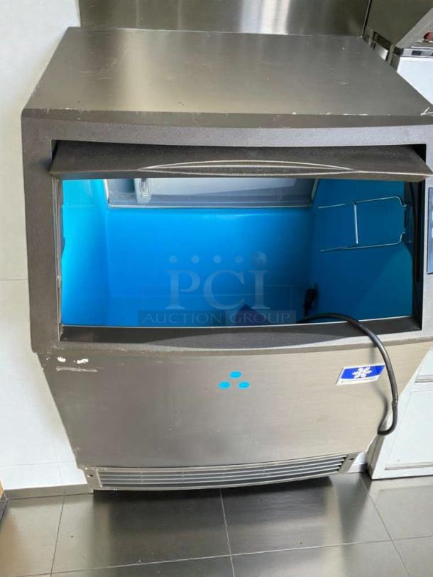 Manitowoc UDF0140A-161B commercial ice maker, excellent condition, 115V, single phase, fully tested, open lid view.
