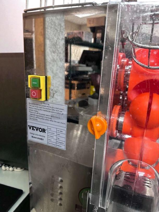 VEVOR 2000E-H commercial orange juicer, premium condition, automatic citrus juicer, ETL listed, with control panel and visible labeling.