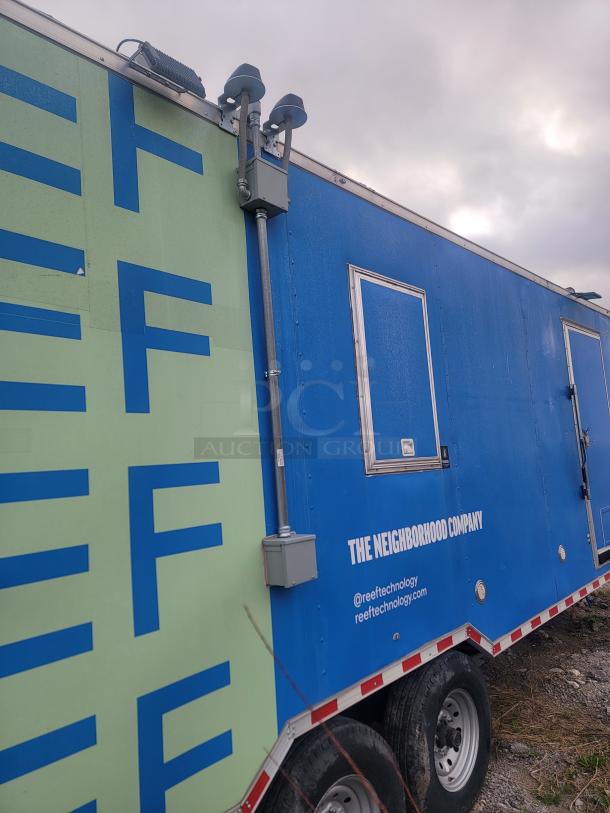 Rock Solid Cargo 24' mobile kitchen trailer, dual-axle, vibrant exterior with visible company branding, needs cleaning.