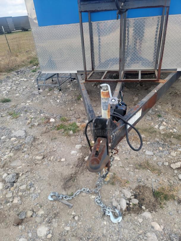 Rock Solid Cargo 24' mobile kitchen trailer hitch. Visible wear. Needs cleaning. Ideal for catering/ghost kitchens. VIN: 573BE2421MF033749.