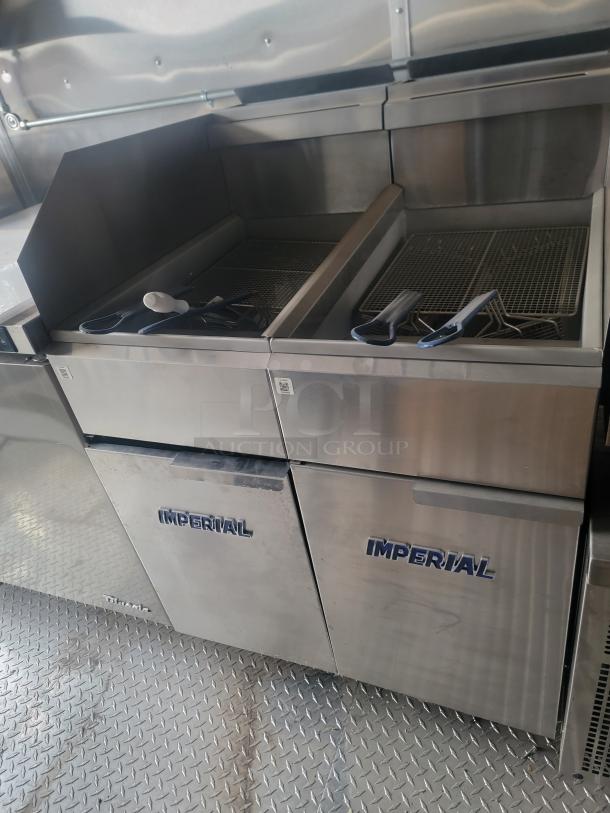 Rock Solid Cargo 24' mobile kitchen with Imperial fryers. Includes Arctic Air fridge, Wells griddle and full exhaust system.