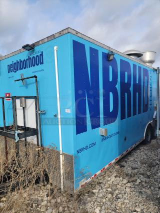 Blue 2020 Diamond Cargo 24' mobile kitchen with "neighborhood" branding, dual-axle chassis, requires cleaning.