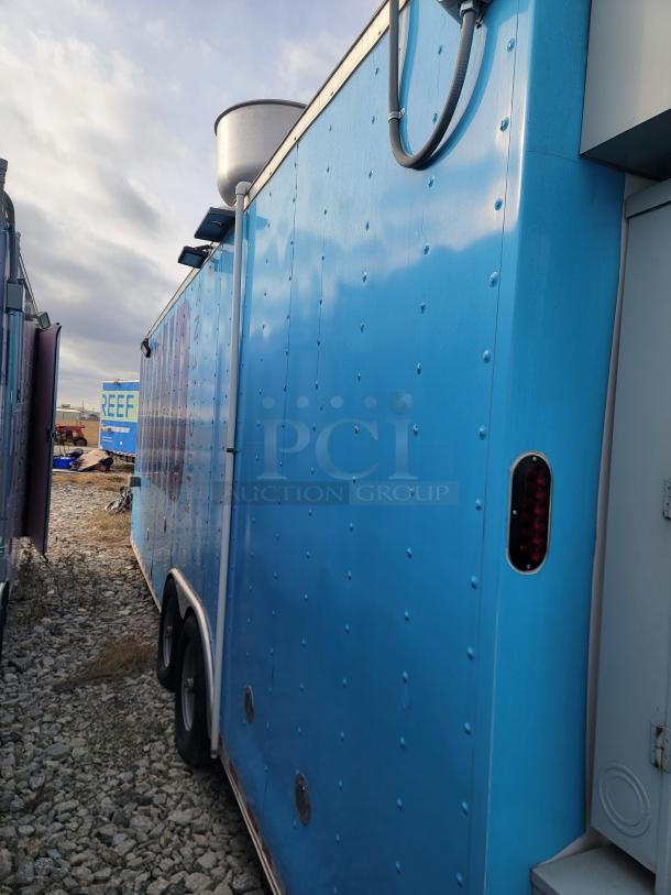 2020 24' Diamond Cargo mobile kitchen exterior. Blue, dual-axle chassis. Needs cleaning. Fully equipped interior.