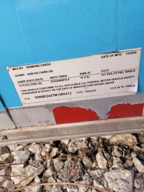 Label on 2020 Diamond Cargo mobile kitchen trailer showing MFG by Diamond Cargo, GVWR 14000 LB, and VIN 53NBE2427M1089412.