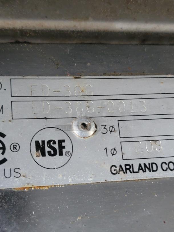 Silver manufacturer's plate with model number FD-36G, NSF certification mark, and Garland Corp branding.