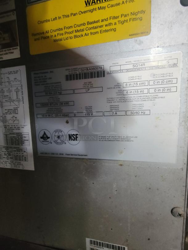 Label inside Diamond Cargo mobile kitchen, showing serial number G21AA060579, model SG14R, gas type LP, NSF certified.