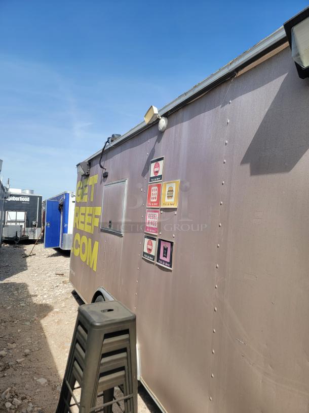 2019 24' Diamond Cargo food trailer, stainless steel, ventilation hood, 3-compartment sink. Needs cleaning, stickers visible.