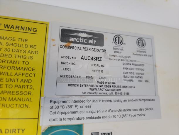 Arctic Air commercial refrigerator label, model AUC48RZ, showing design pressures, serial number, and manufacturing details.