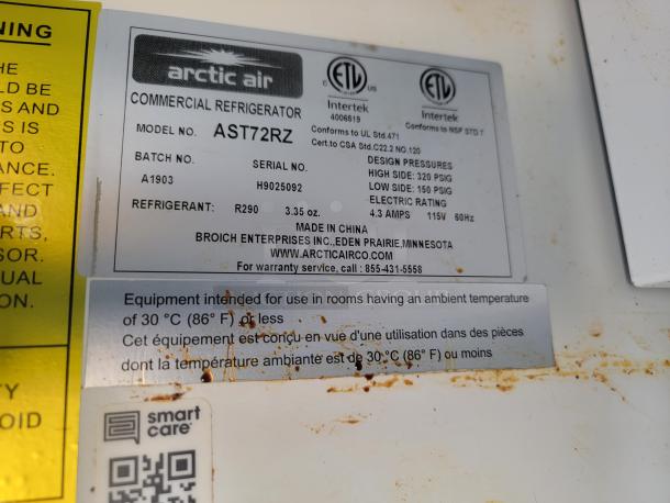 Arctic Air commercial refrigerator label, model AST72RZ. Includes design pressures, refrigerant, and electrical rating details.