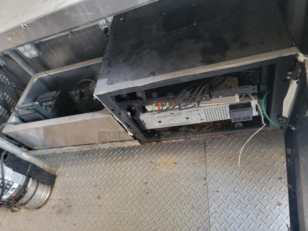 2019 24' Diamond Cargo food trailer interior showing stainless steel sink and equipment. Needs deep cleaning. High-end infrastructure.