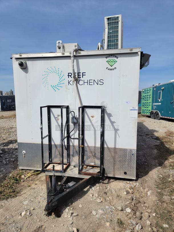 2019 24' Diamond Cargo mobile kitchen with Arctic Air refrigeration, dual fryers, flat-top griddle. Needs cleaning.