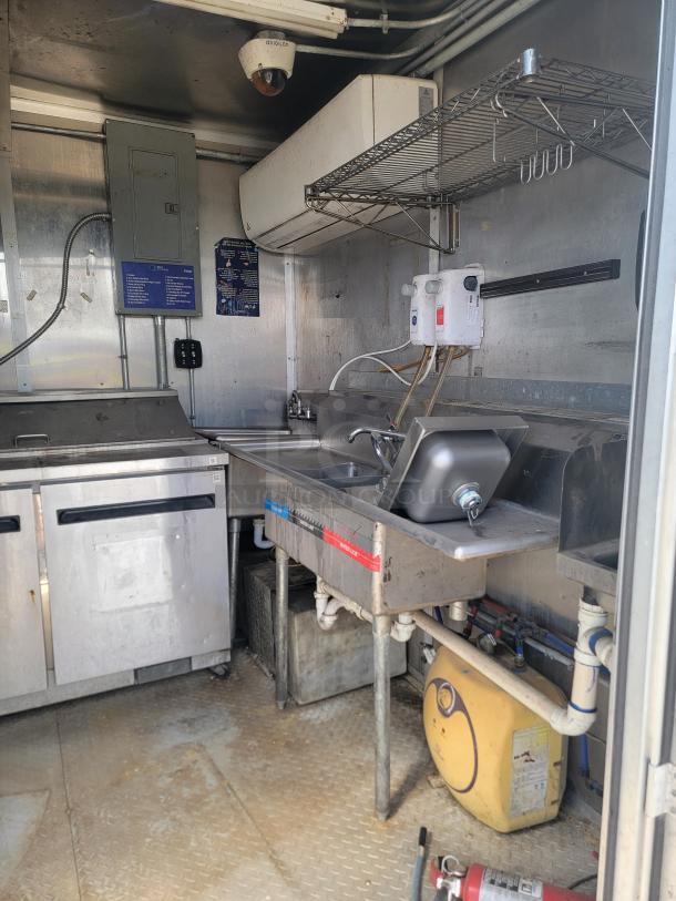 2019 Diamond Cargo 8.5x24 mobile kitchen, featuring Arctic Air fridge, dual fryers, griddle, multi-sink system, needs cleaning.