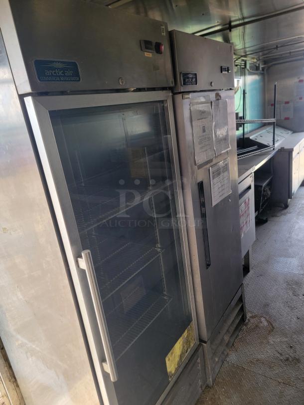 2019 Diamond Cargo 8.5x24 mobile kitchen with Arctic Air refrigerator. Features stainless exhaust hood, needs cleaning.