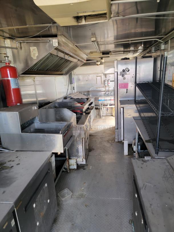 2019 Diamond Cargo 8.5x24 mobile kitchen with Arctic Air fridge, dual fryers, griddle, exhaust hood; needs cleaning. VIN: 53NBE2428L1076036.