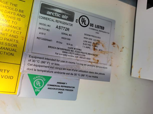 Label of Arctic Air Commercial Refrigerator, Model AST72R. Details include UL certification, refrigerant type R134a, and usage specs.