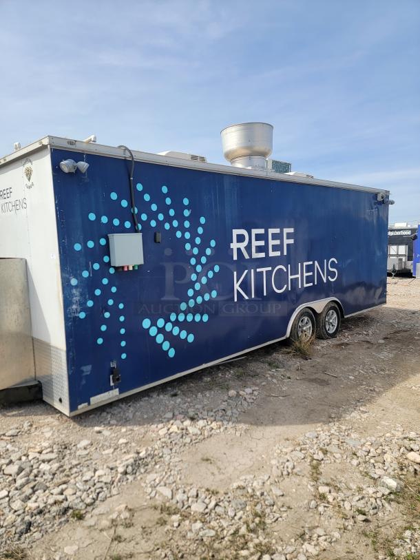 2019 Diamond Cargo 24' mobile ghost kitchen trailer with dual axles, branded "Reef Kitchens," air vent on top.