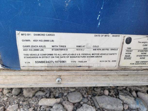 Label on a 2019 Diamond Cargo 24' trailer showing specifications, weight limits, tire size, and VIN: 53NBE2427L1076061.