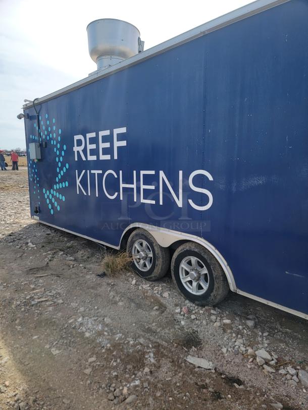 2019 Diamond Cargo 24' mobile kitchen trailer, blue with "Reef Kitchens" branding, tandem axles, external vent hood visible.