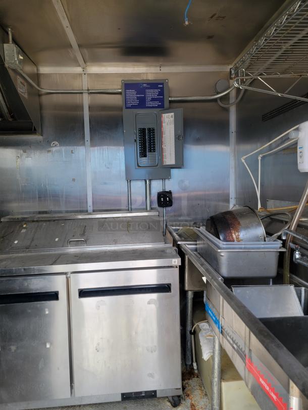 2019 Diamond Cargo 24' mobile kitchen interior with Arctic Air units, sink, and breaker panel in professional setup.