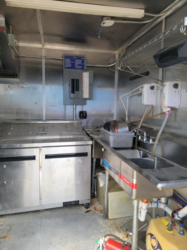 2019 Diamond Cargo 24' mobile ghost kitchen interior with Arctic Air refrigeration, Vulcan range, sink system, and commercial vent.