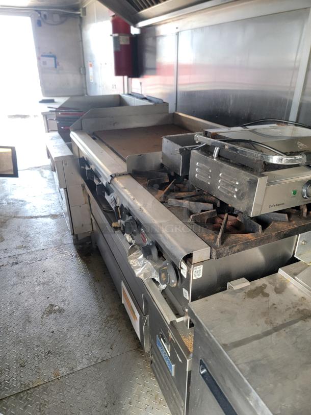 2019 Diamond Cargo 24' mobile kitchen with Arctic Air fridge, Vulcan griddles, Chef's Supreme press, and vent hood.