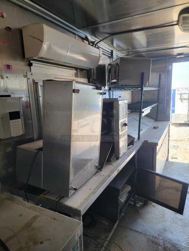 2019 Diamond Cargo 24' mobile kitchen interior with Arctic Air refrigeration, Vulcan range, and Pioneer AC unit.