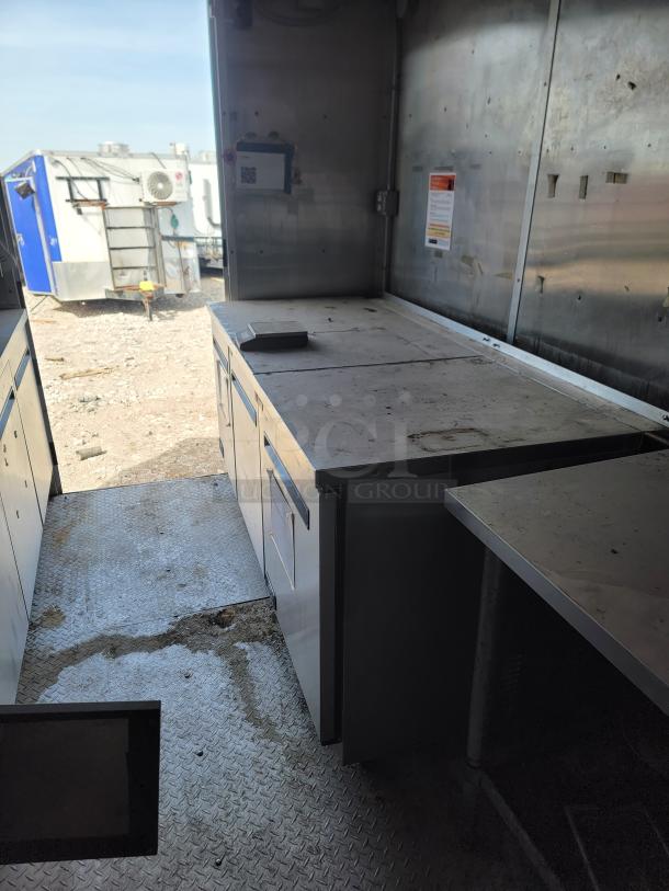 2019 Diamond Cargo 24' mobile kitchen interior with metal counters, storage, and ventilation. Professional-grade equipment setup.