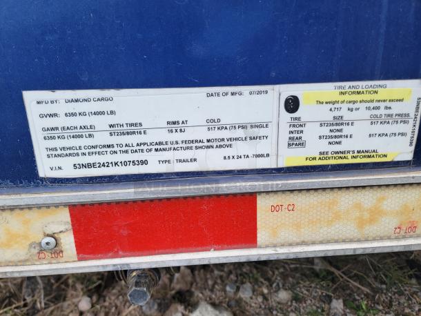 2019 Diamond Cargo 24' Mobile Kitchen label showing GVWR 14,000 LB, tire specs, and VIN 53NBE2421K1075390.