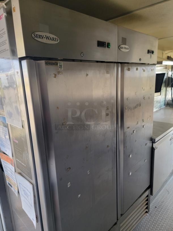 2019 Diamond Cargo mobile kitchen with Serv-Ware refrigerator, dual-axle trailer, and professional equipment. Needs cleaning and minor repairs.