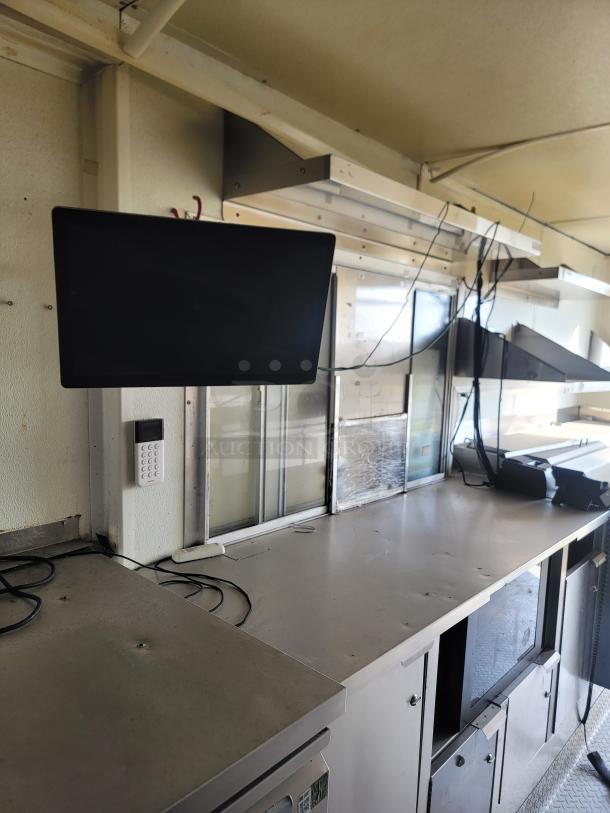 2019 Diamond Cargo 24' mobile kitchen interior; professional Serv-Ware and Dukers equipment, shelving, and workspace visible.